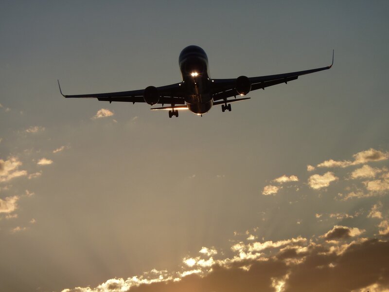 Airplane in Flight — Blue, Dramatic, Sunset, Photograph, Sky, Clouds, Sunlight