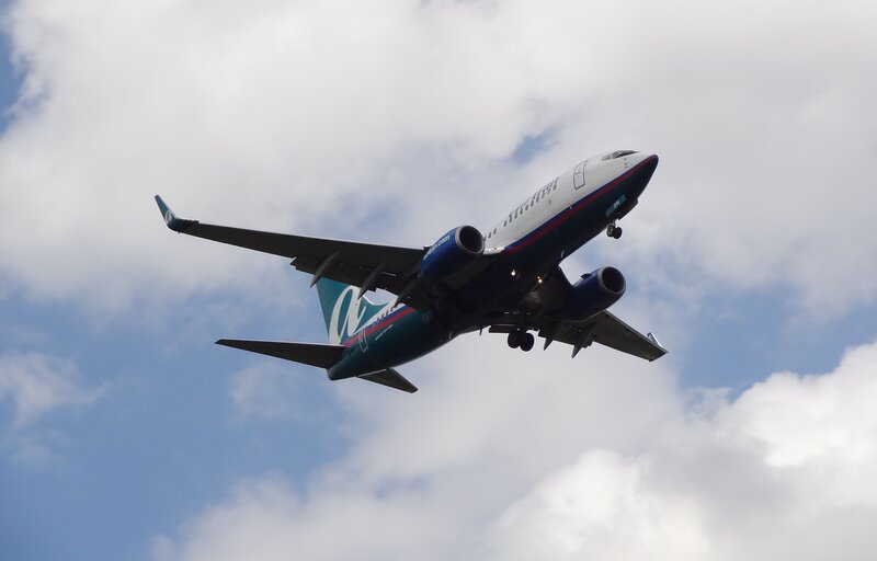 Airplane in Flight — Blue, Dynamic, Afternoon, Photograph, Clouds