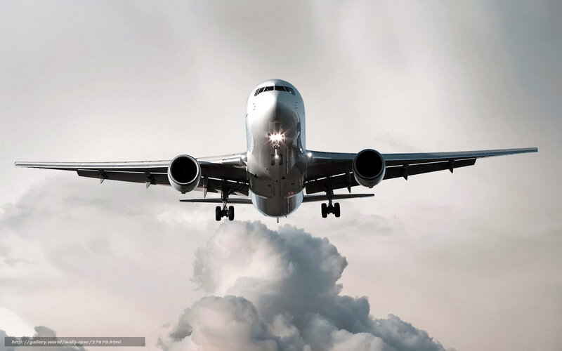 Airplane in Flight — Gray, Dramatic, Photograph, Clouds, Wings