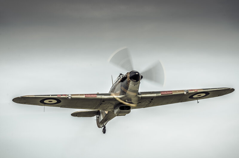 Airplane in Flight — Gray, Dramatic, Photograph, Propeller