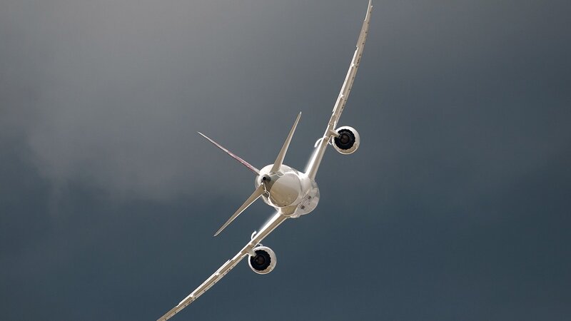 Airplane in Flight — Gray, Dramatic, Photograph, Sky