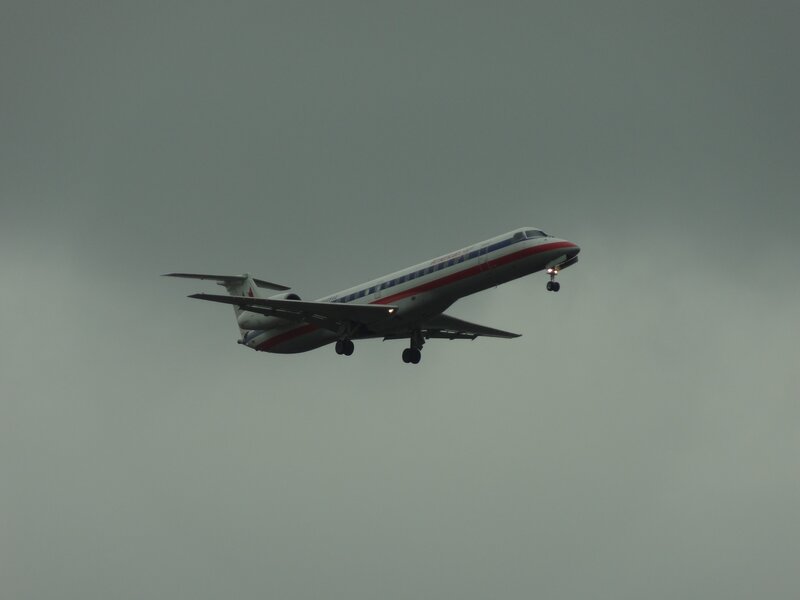 Airplane in Flight — Gray, Overcast, Photograph, Sky, Landing Gear