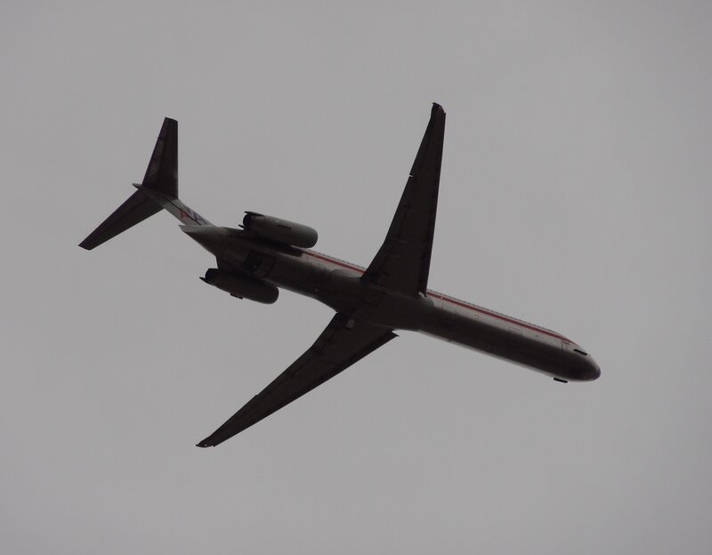 Airplane in Flight — Gray, Overcast, Photograph, Sky