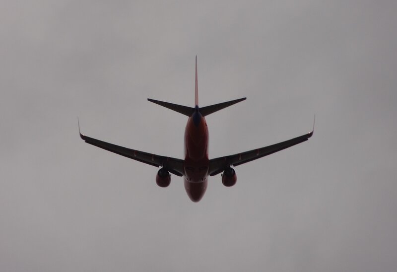 Airplane in Flight — Gray, Overcast, Photograph, Sky, Wings