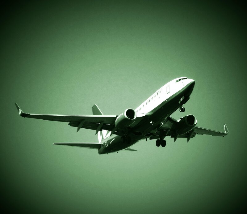 Airplane in Flight — Green, Dramatic, Photograph