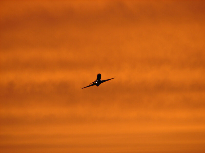 Airplane in Flight — Orange, Dramatic, Sunset