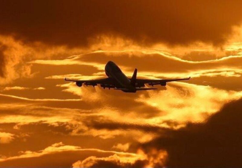 Airplane in Flight — Orange