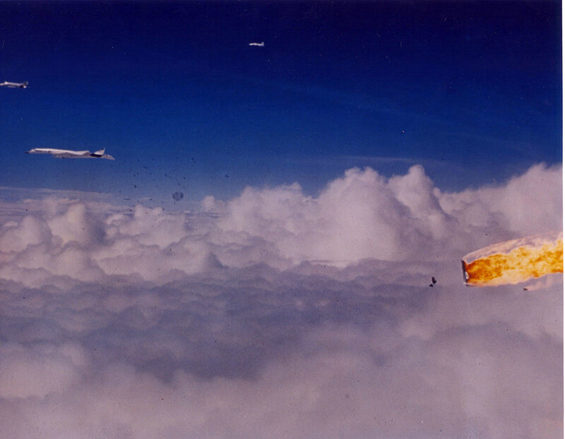 Airplane in flight over clouds