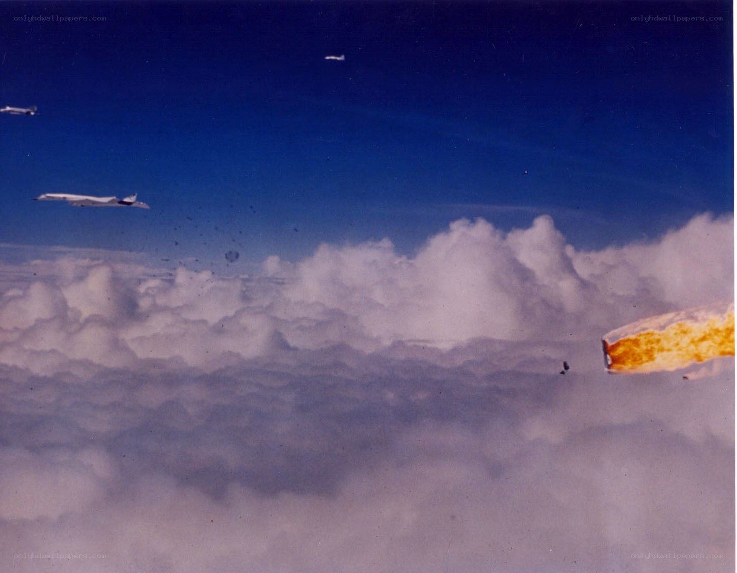 Airplane in flight over clouds