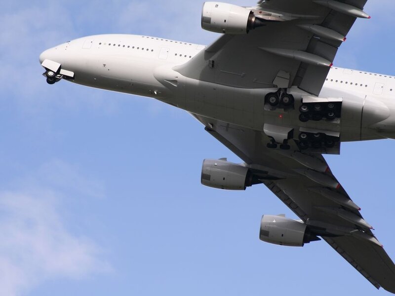 Airplane in Flight — White, Calm, Afternoon