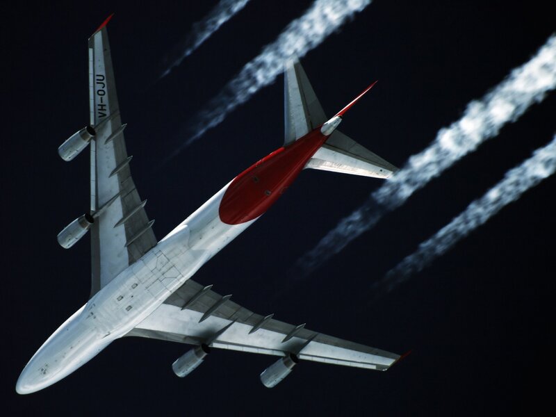 Airplane in Flight — White, Dramatic