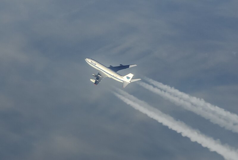 Airplane in Flight — White, Serene, Photograph
