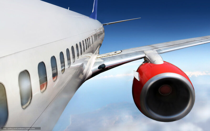Airplane in flight with red engine