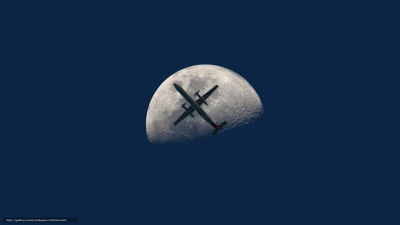 Airplane in front of the moon