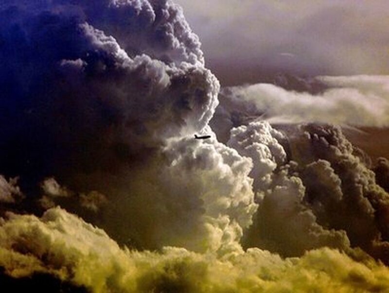 Airplane in Storm Clouds