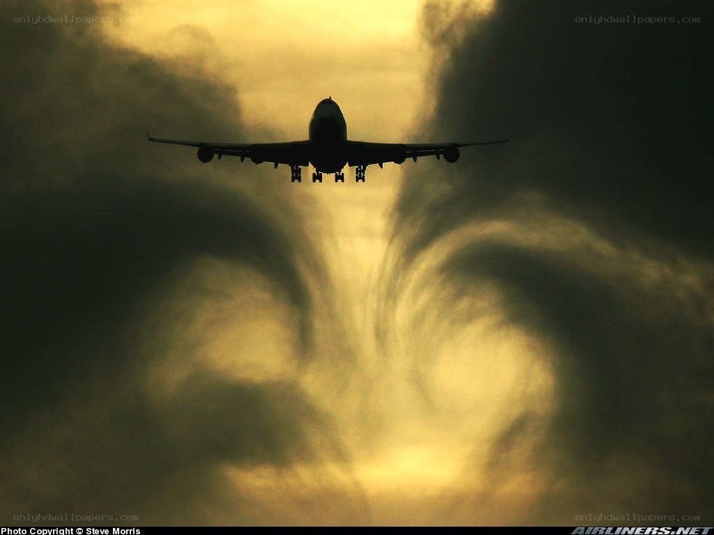 Airplane in stormy sky