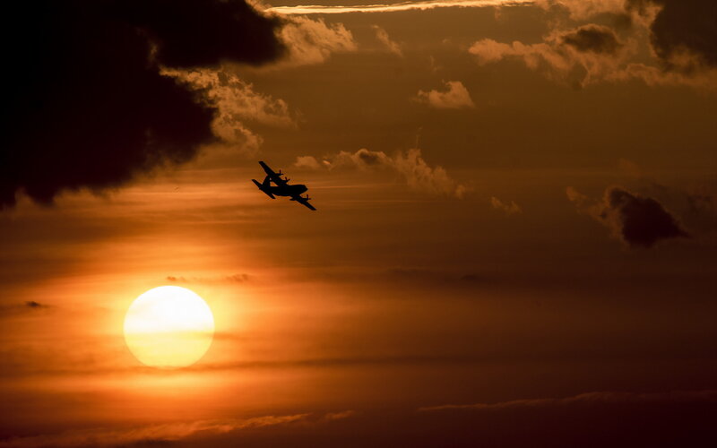 Airplane in Sunset Sky — Orange, Dramatic, Photograph