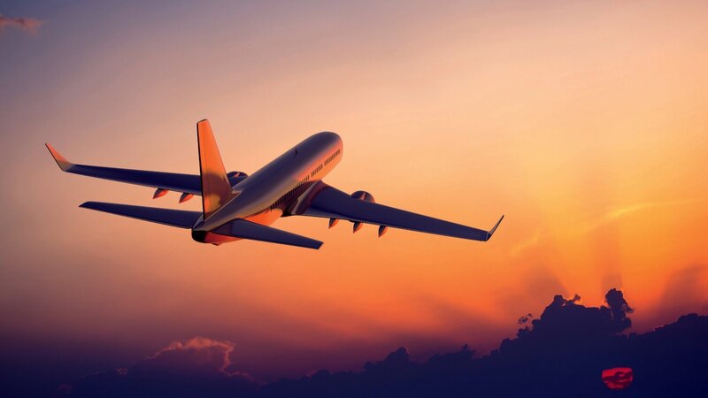 Airplane in Sunset Sky — Orange, Dramatic