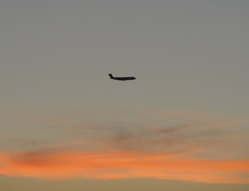 Airplane in Sunset Sky — Orange, Serene
