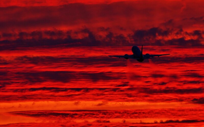 Airplane in Sunset Sky — Red, Dramatic, Photograph, Clouds