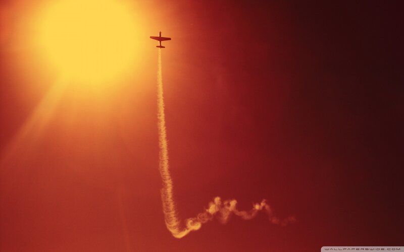 Airplane in Sunset Sky — Red, Dramatic