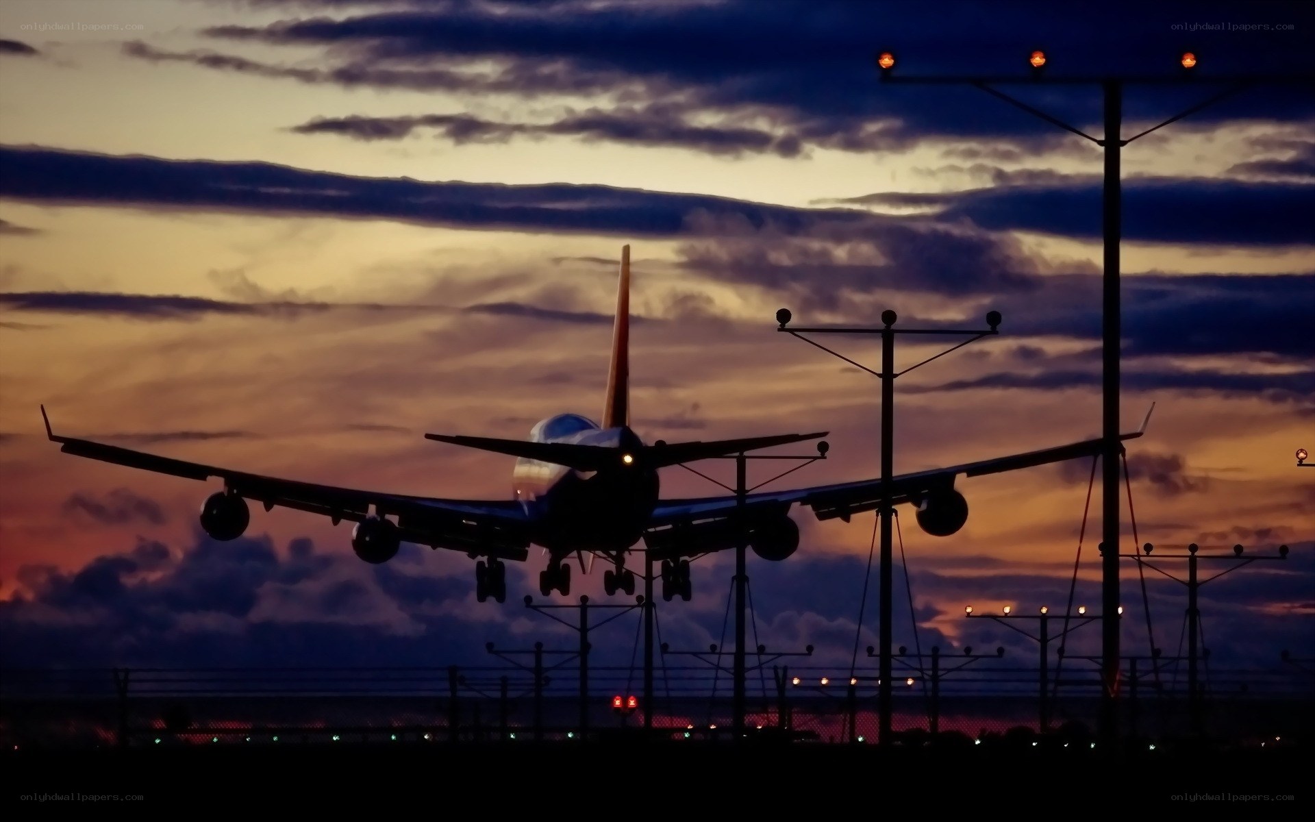 Airplane landing at dusk
