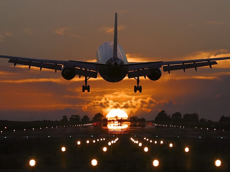 Airplane Landing at Sunset — Orange, Dramatic, Photograph, Runway, Clouds