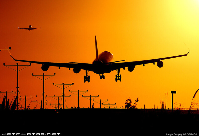 Airplane Landing at Sunset — Orange, Dramatic, Photograph, Runway Lights