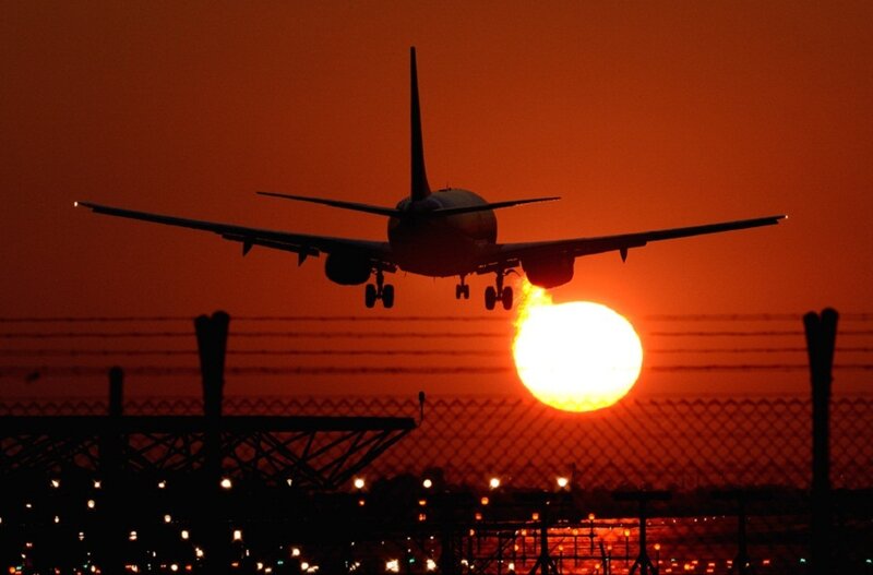 Airplane Landing at Sunset — Orange