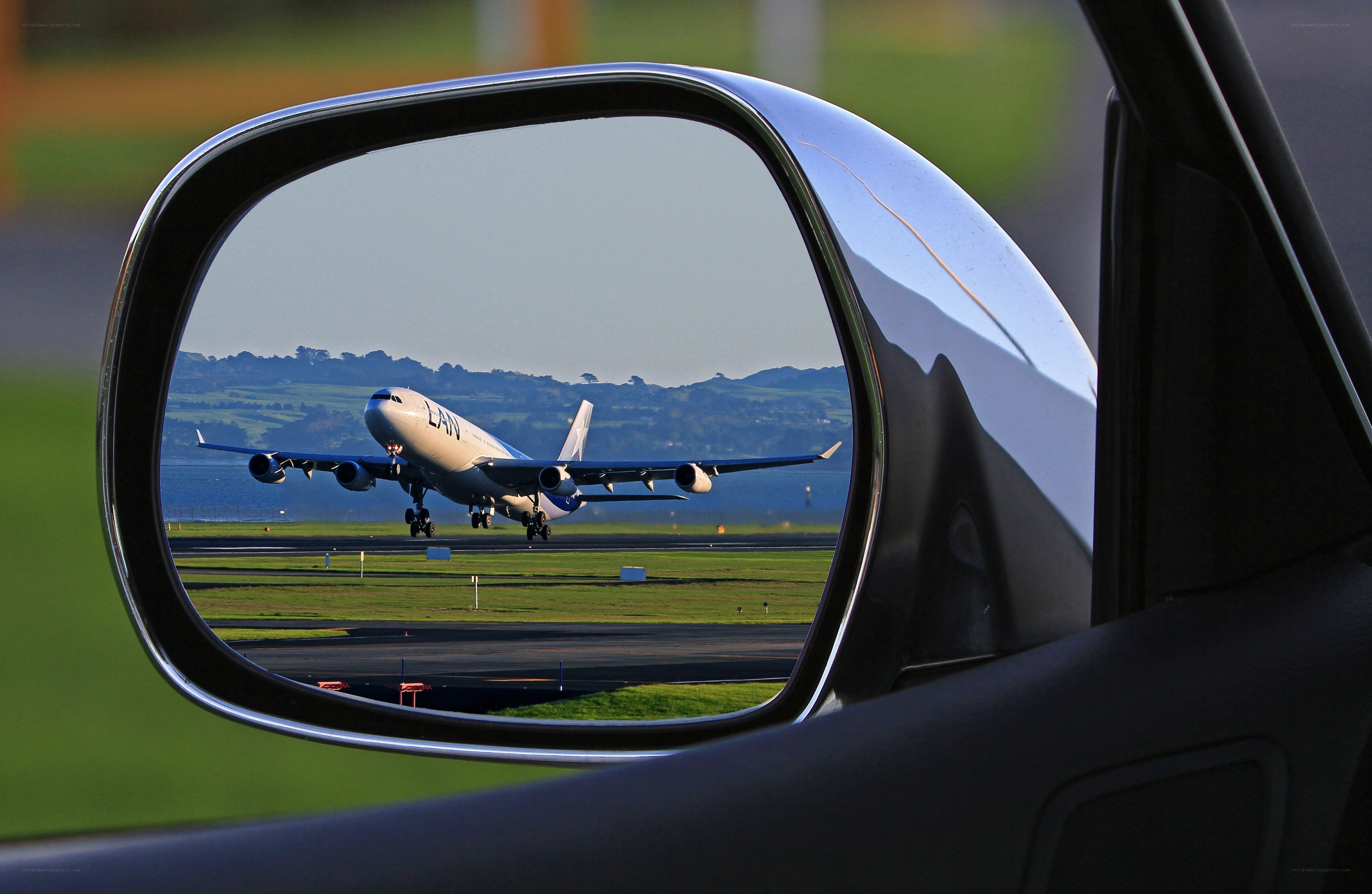 airplane landing in mirror