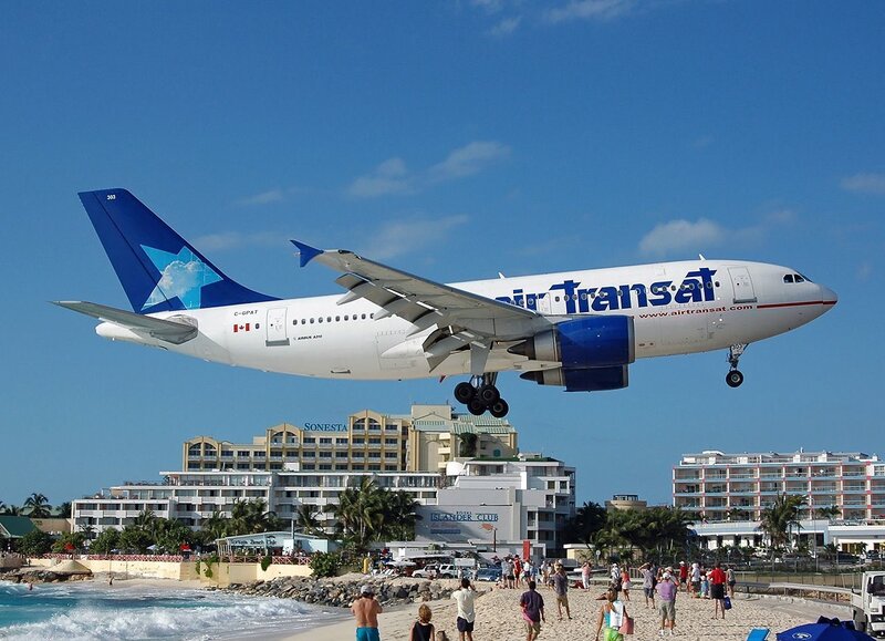 Airplane landing near beach