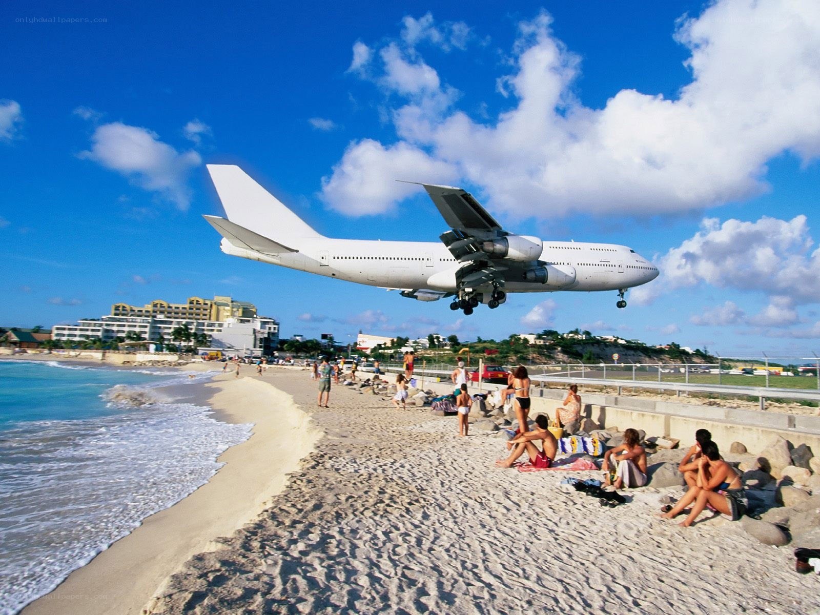 Airplane landing near beach