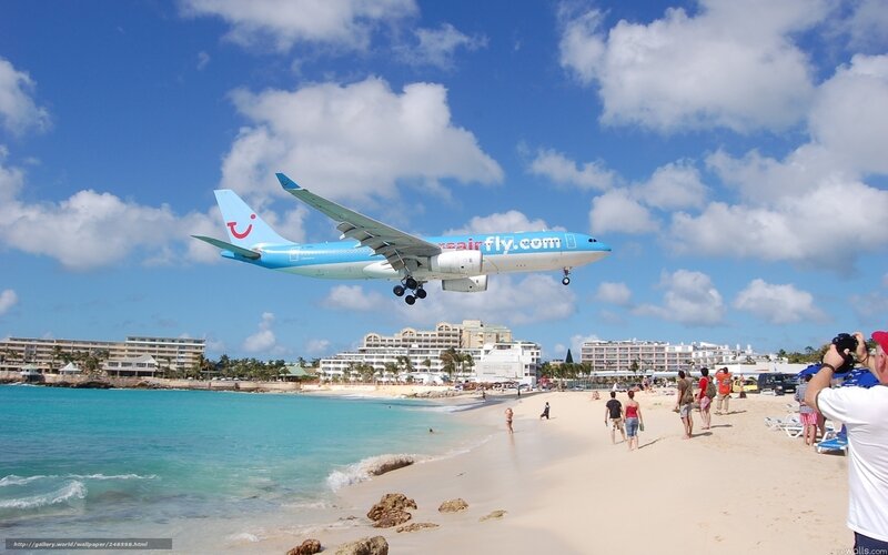 Airplane Landing on Beach — Blue, Bright, Sunny