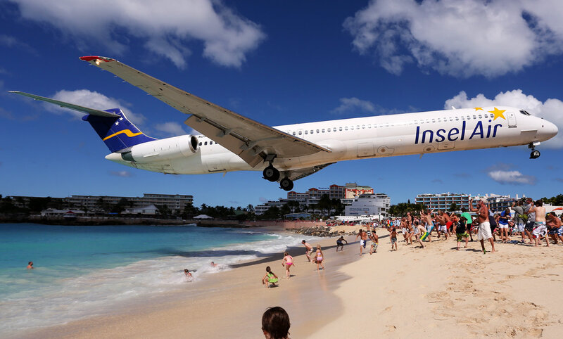 Airplane Landing on Beach — Blue, Dramatic, Afternoon