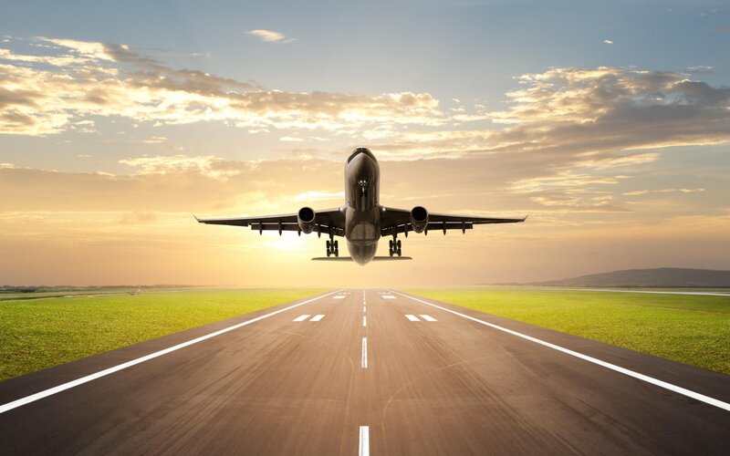 Airplane Landing on Runway — Green