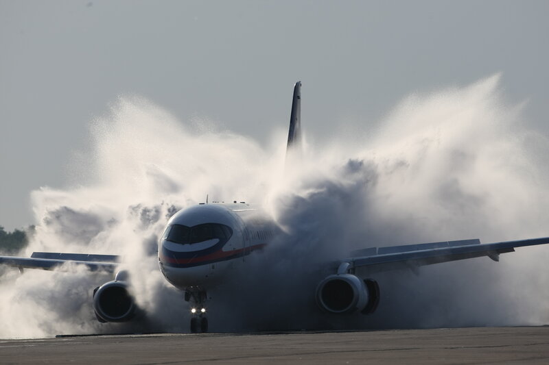 Airplane landing on wet runway