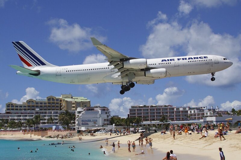 Airplane Landing over Beach — Blue, Active, Afternoon