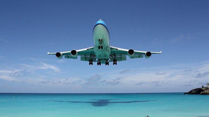 Airplane Landing over Ocean
