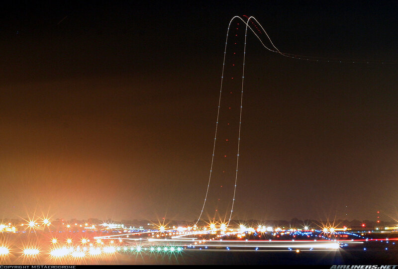 Airplane light trails at night