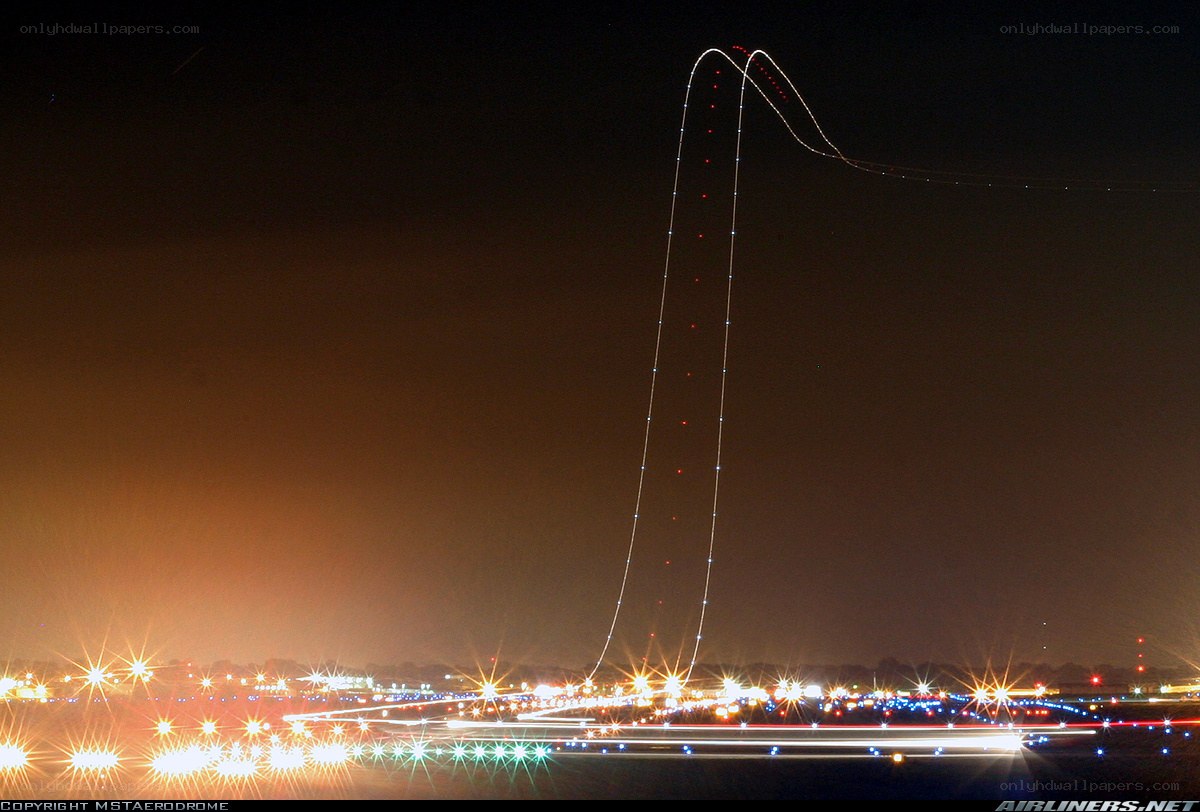Airplane light trails at night