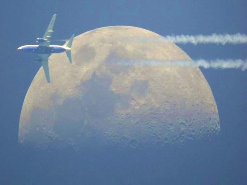 Airplane Near Moon — Blue, Dramatic