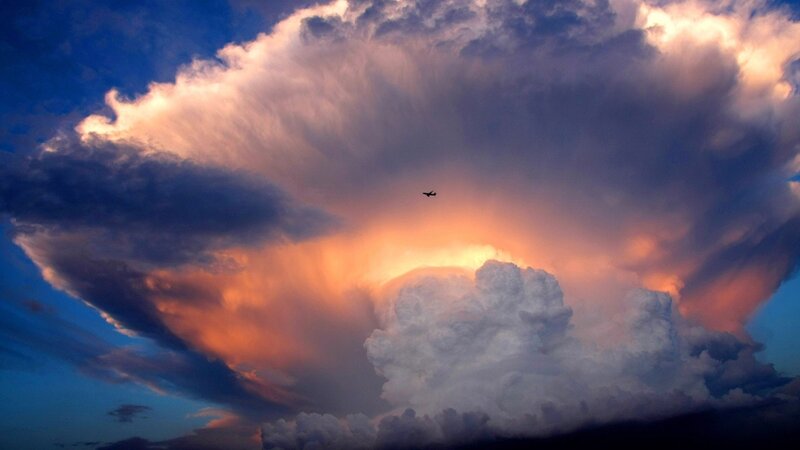 Airplane Near Storm Cloud — Blue, Dramatic, Sunset