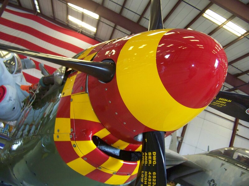 airplane nose with red and yellow paint