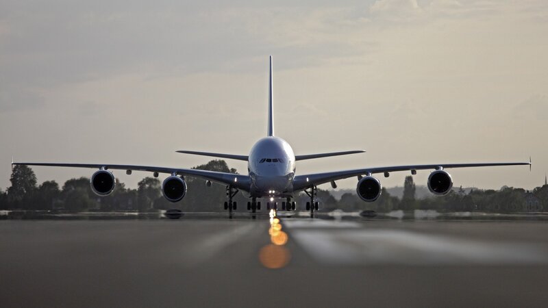 Airplane on a runway at dusk