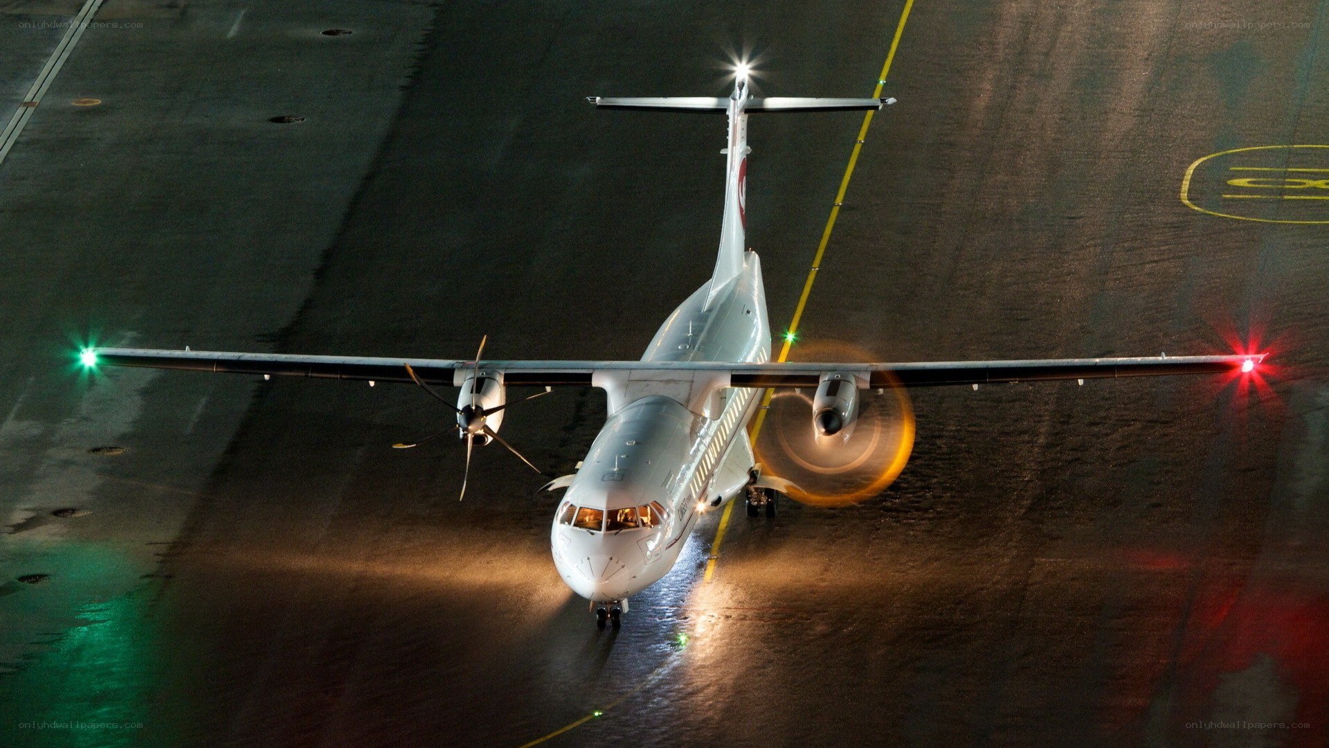 Airplane on a runway at night