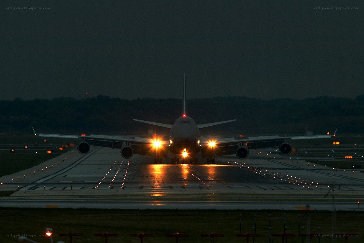 Airplane on runway at night