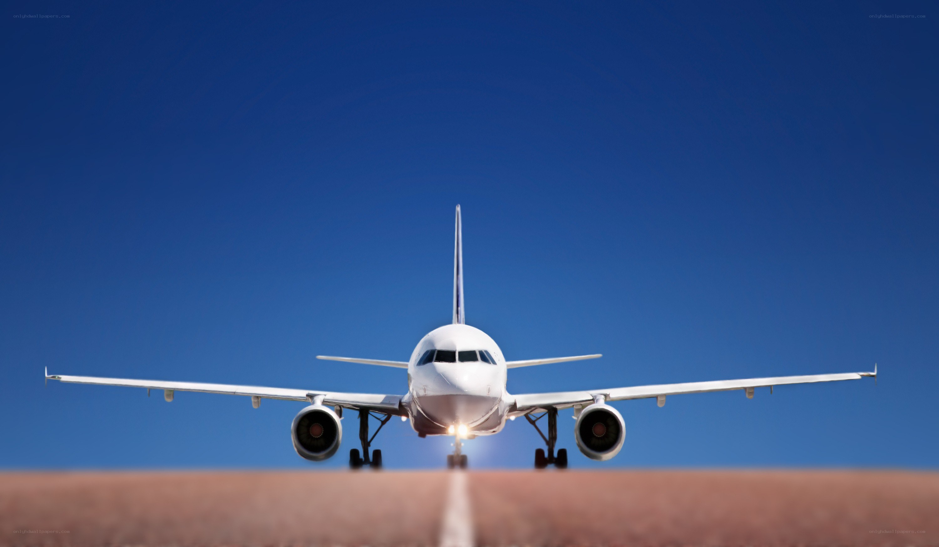 airplane on runway at sunset