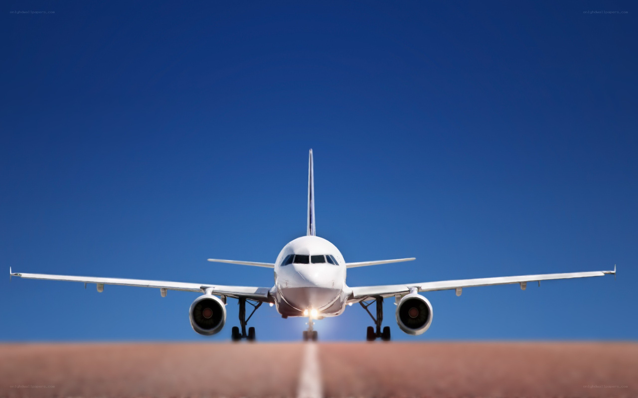 airplane on runway at sunset