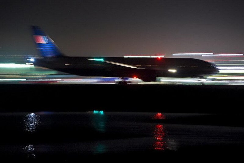 Airplane on Runway — Black