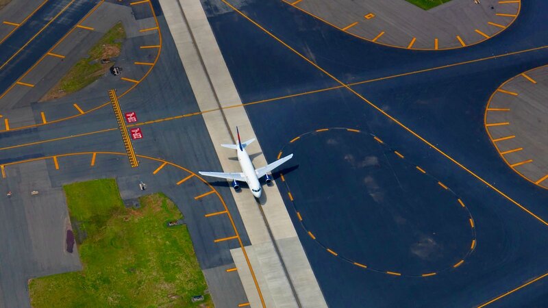 Airplane on Runway — Gray, Calm